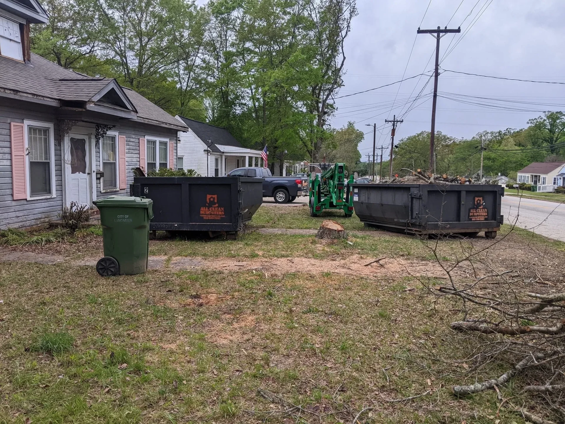 A yard with several different types of garbage.